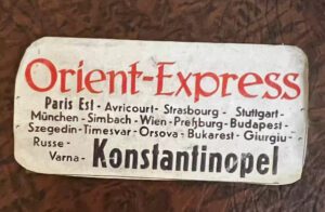 Vintage Orient Express train car on display at Sirkeci Station in Istanbul, showcasing classic luxury rail travel history.